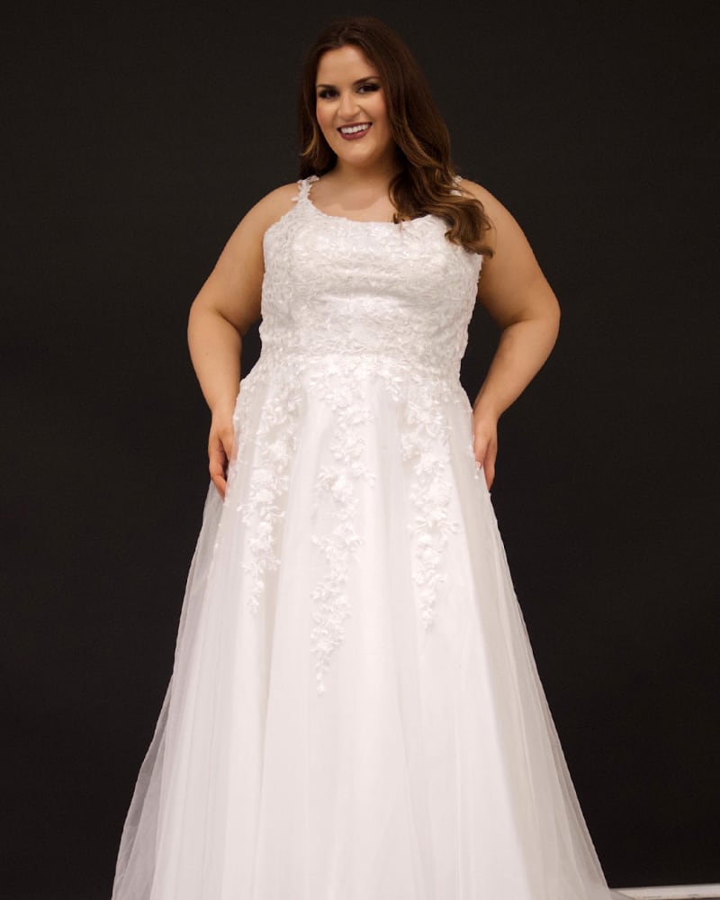 Front of a model wearing a size 18 Kara Wedding Dress in Ivory by Sydney's Closet. | dia_product_style_image_id:286678
